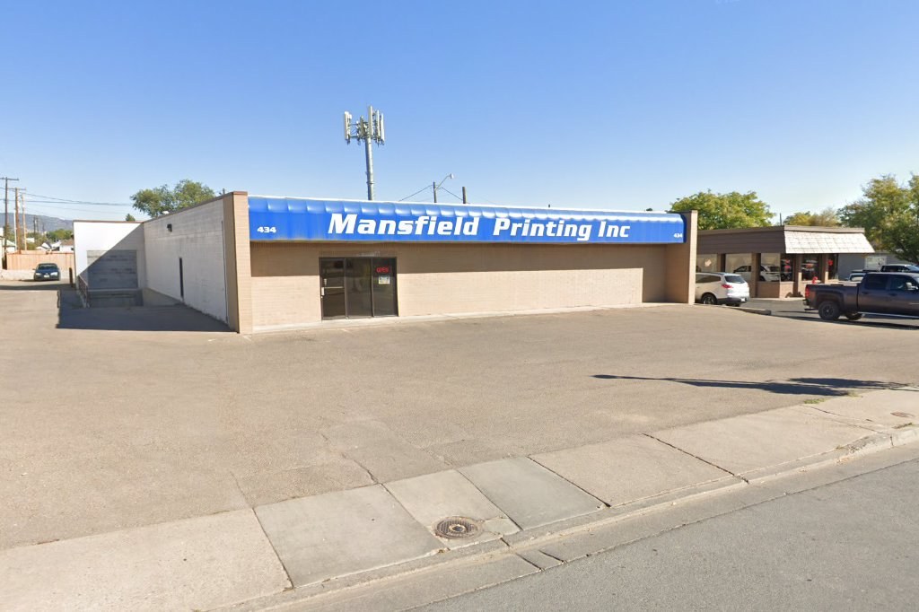 Blue awning reading Mansfield Printing Inc at 434 W Main St, Vernal, with a red OPEN neon in the door